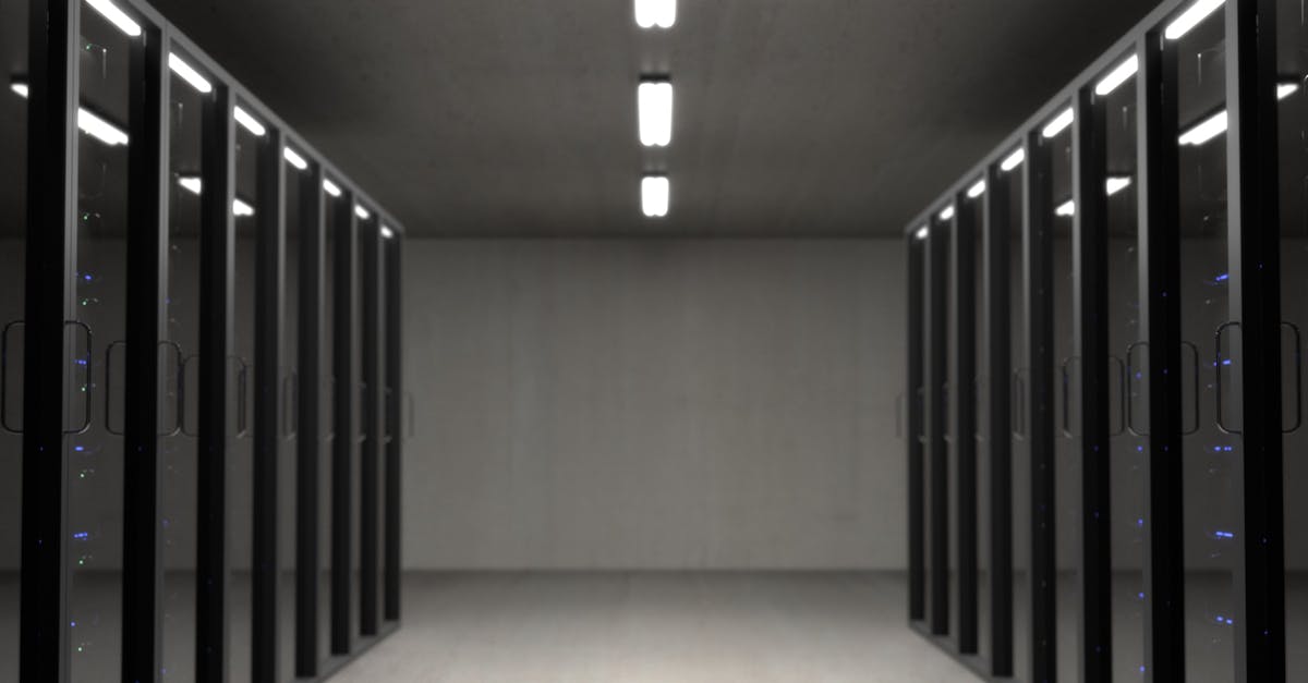Server racks inside a modern data centre with blue indicator lights