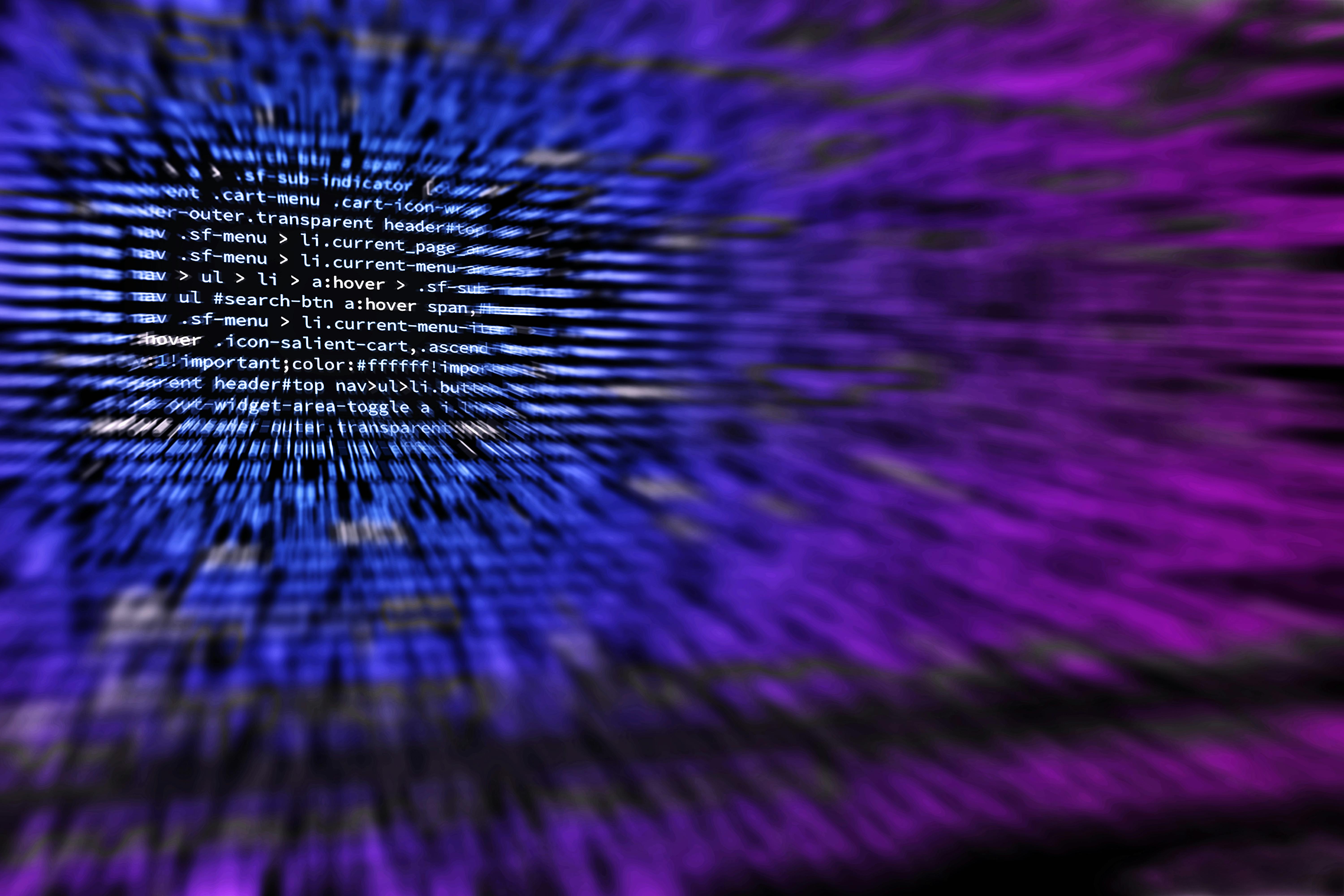 Abstract digital background with computer code representing cybersecurity threats and malware